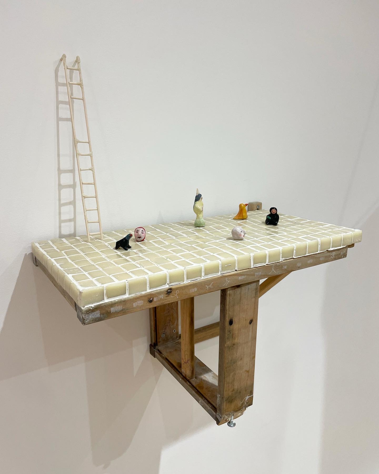 Mixed media sculpture made of wood, clay & found objects